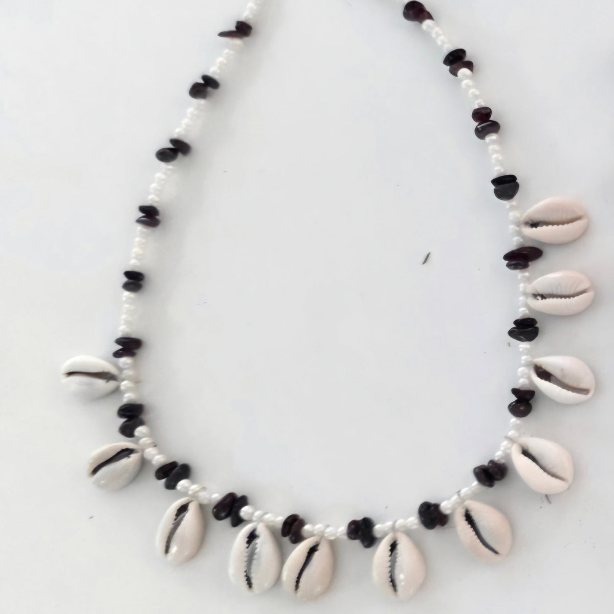 Cowrie shell & Garnet necklace